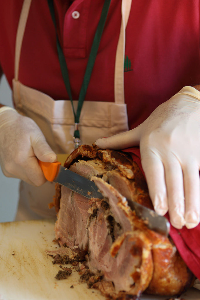 Sliced Tuscan Roast Porchetta oven cooked with Chianti herbs